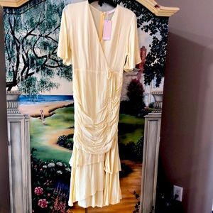 Formal Pale Yellow Dress. Center has Tue bow to lift any length,.